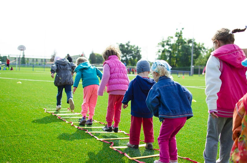 Children engaging in safe weightlifting practices