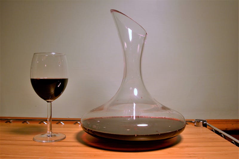 Pouring wine into a stylish decanter