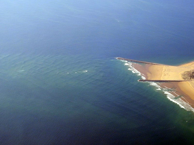 Formation of ocean waves due to wind.