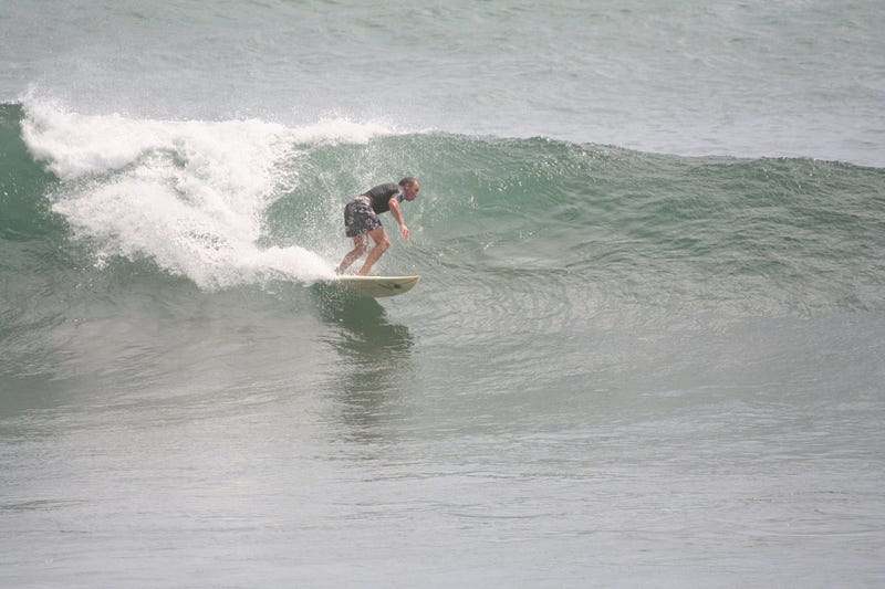 Father surfing in Costa Rica